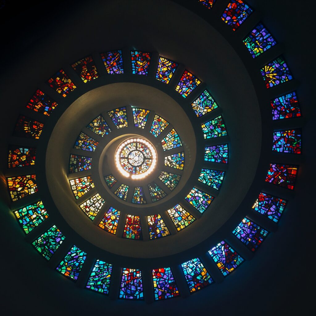 mundane to holy, stained glass window spiral